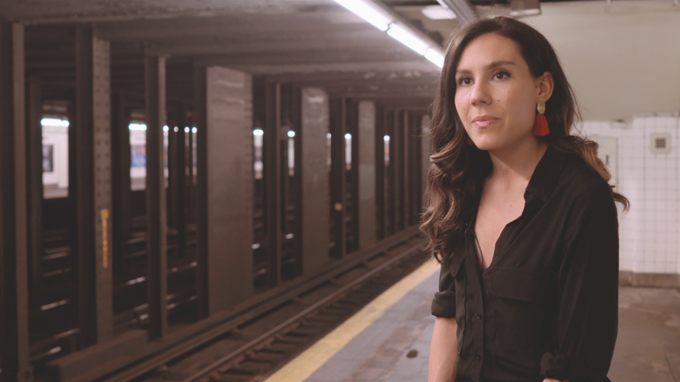 Image of a woman on a New York city subway platform