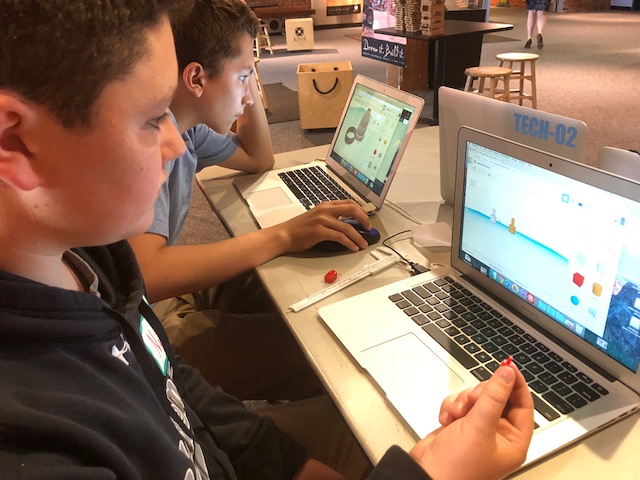 students designing on a computer