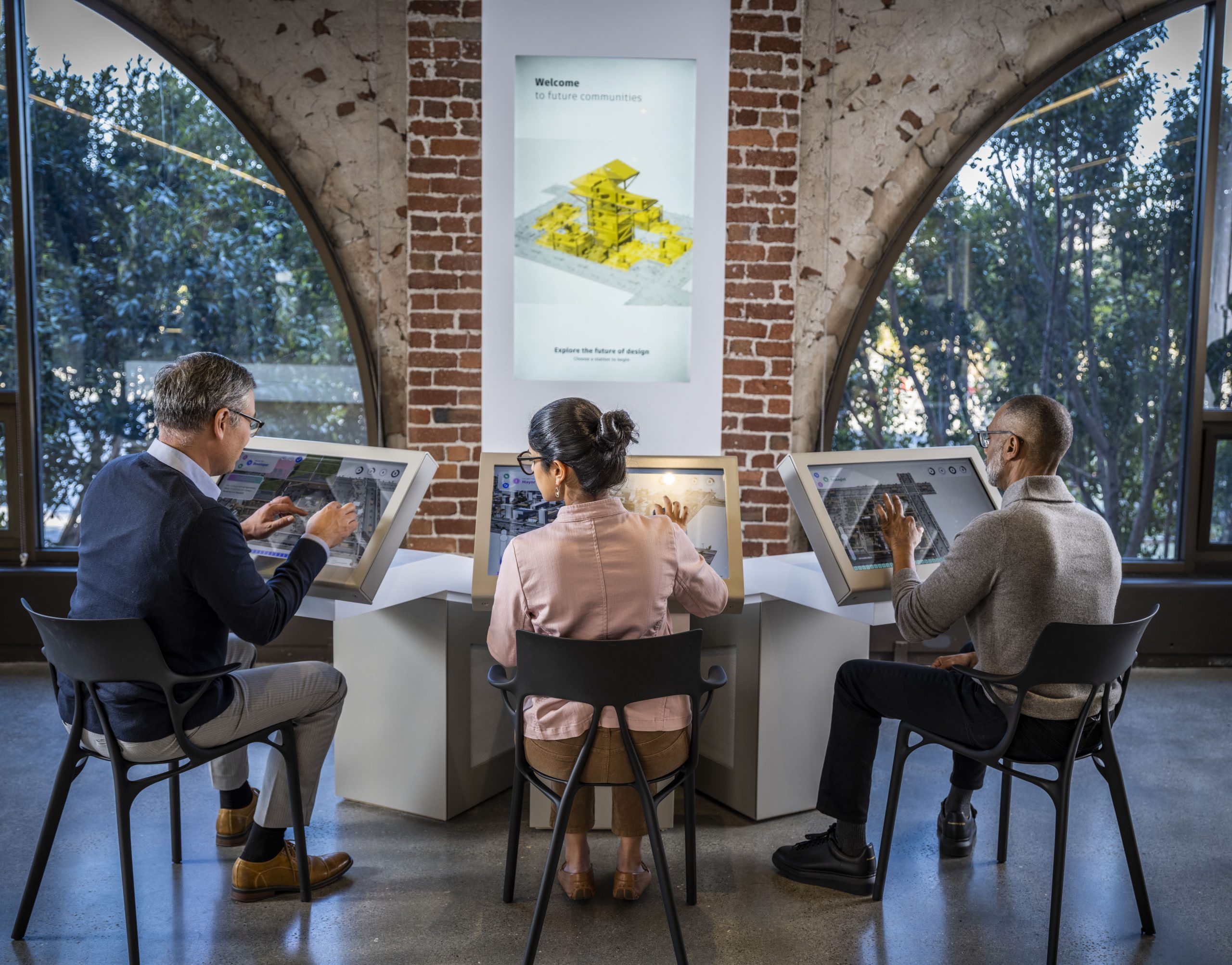 People experiencing the Future Communities digital experience at the Autodesk Gallery