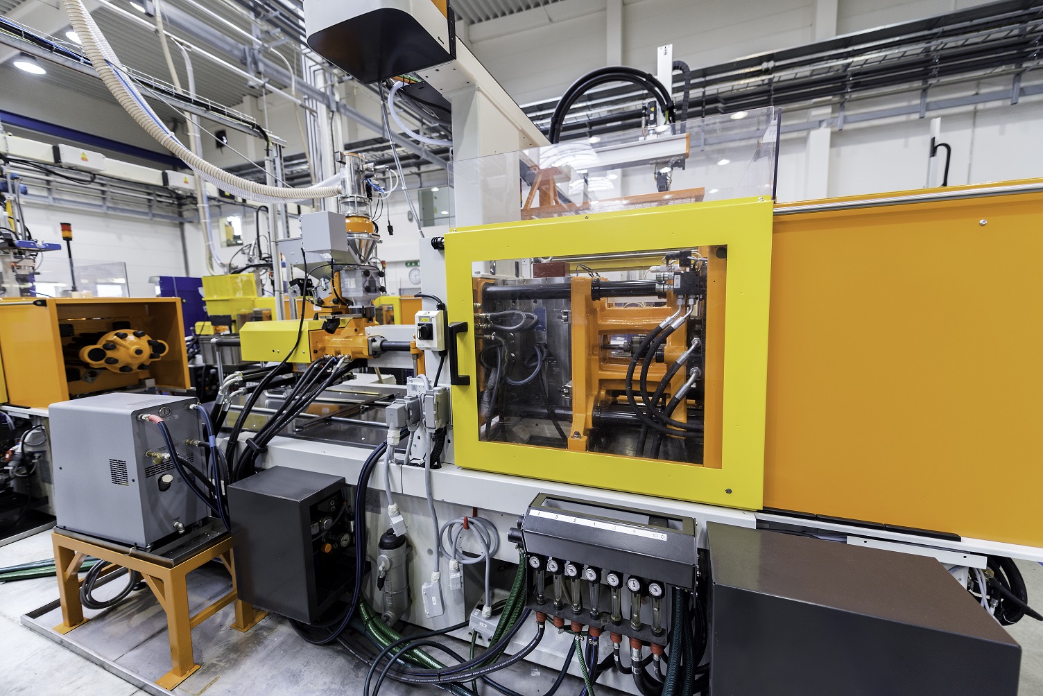 Injection molding machine in a connected factory.