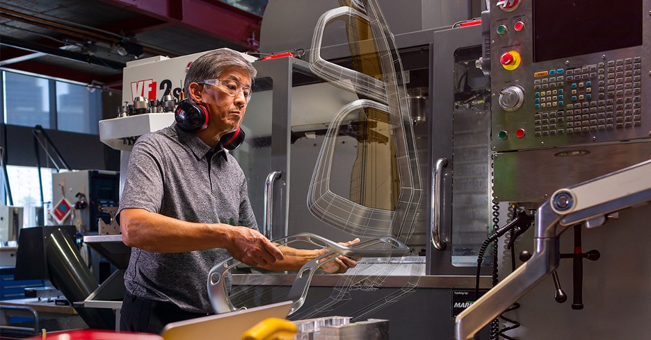 A man develops a generatively-designed frame. 