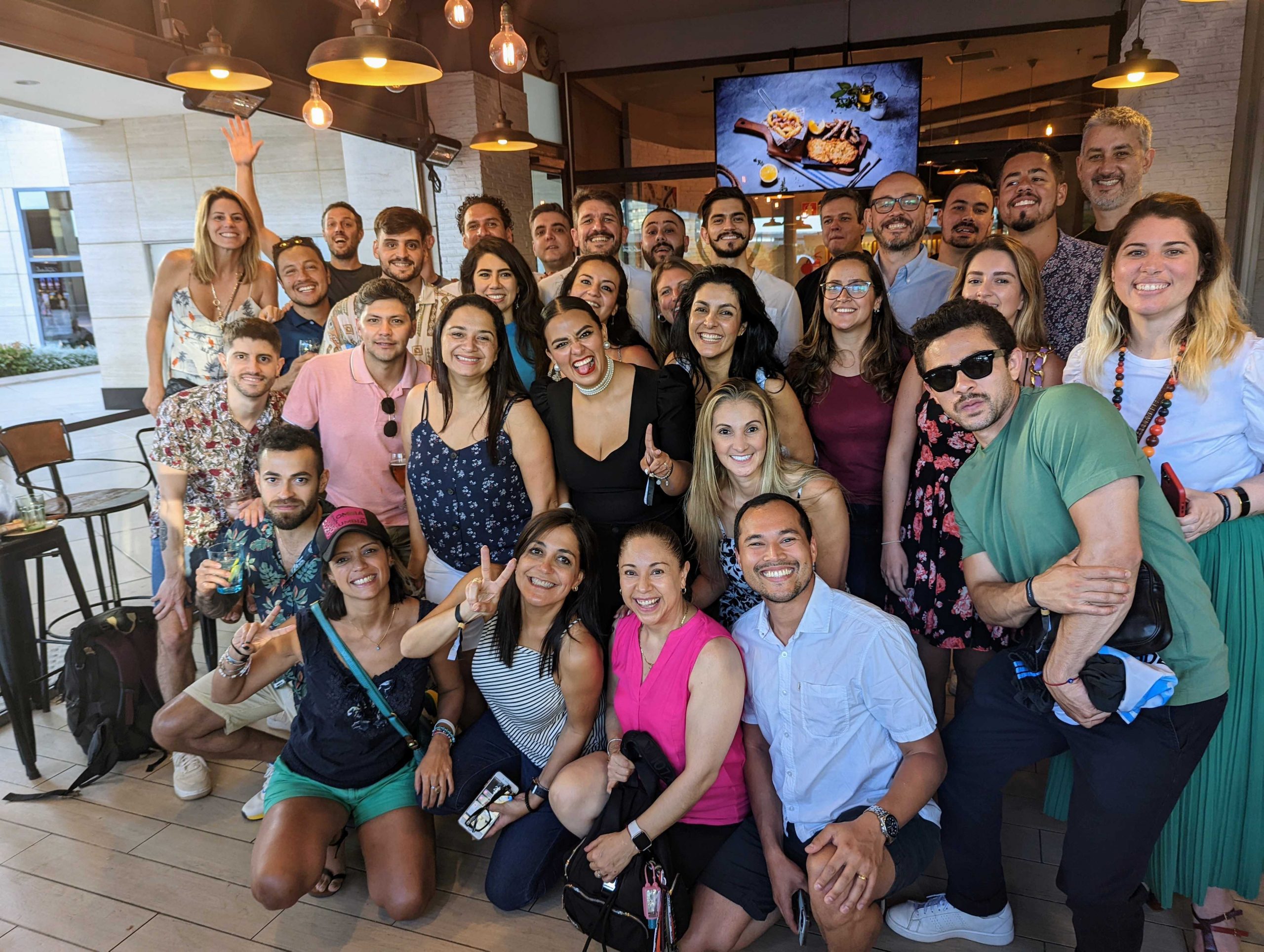 Employees posing for a group photo together in the office