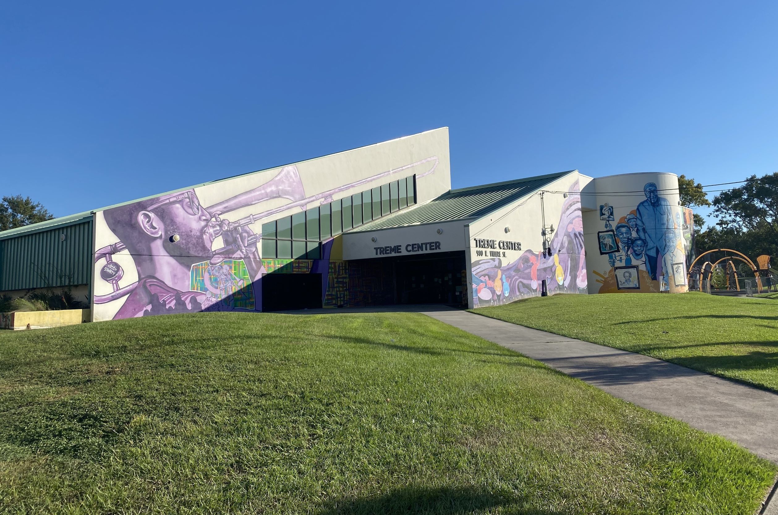 Community center with mural of jazz musician