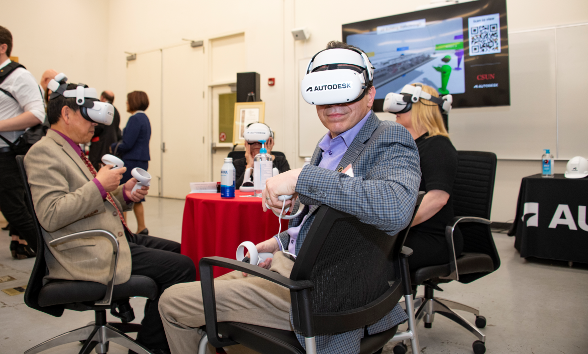 People wearing Autodesk-branded extended reality (XR) headsets