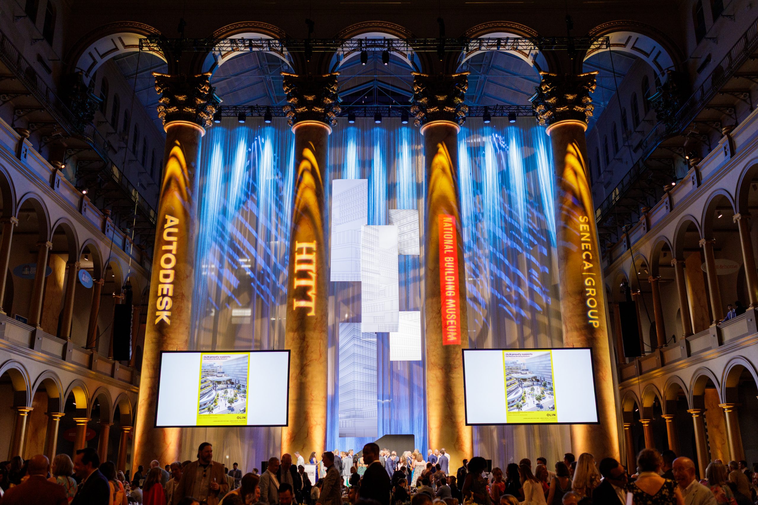 The inside of a building with banners and screens